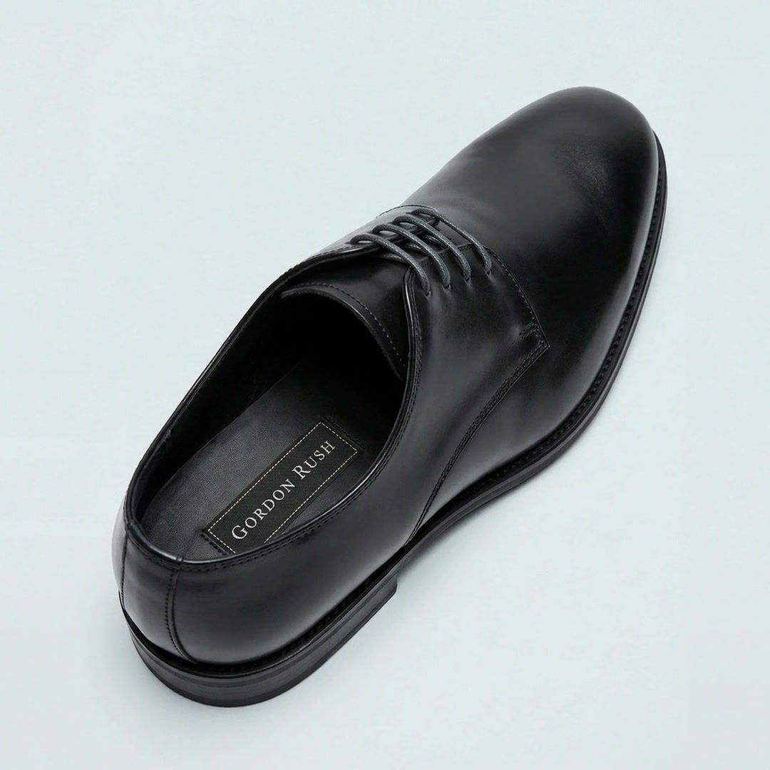A black Whitmore derby on a white ground